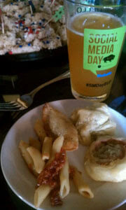Photo of pint glass and food from the event.