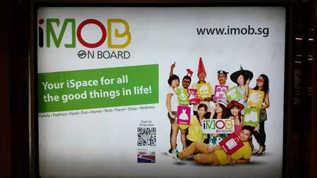 Wall ad for iMOB featuring a QR code.