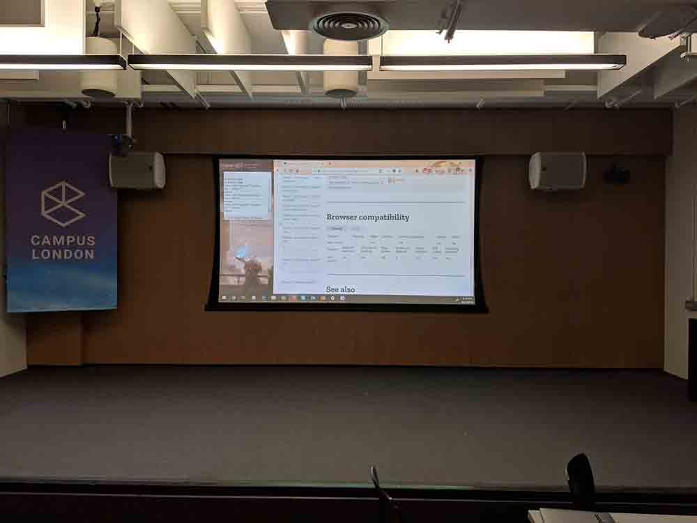 Projector screen showing a Firefox window open to an MDN page with the NVDA Speech Viewer visible.
